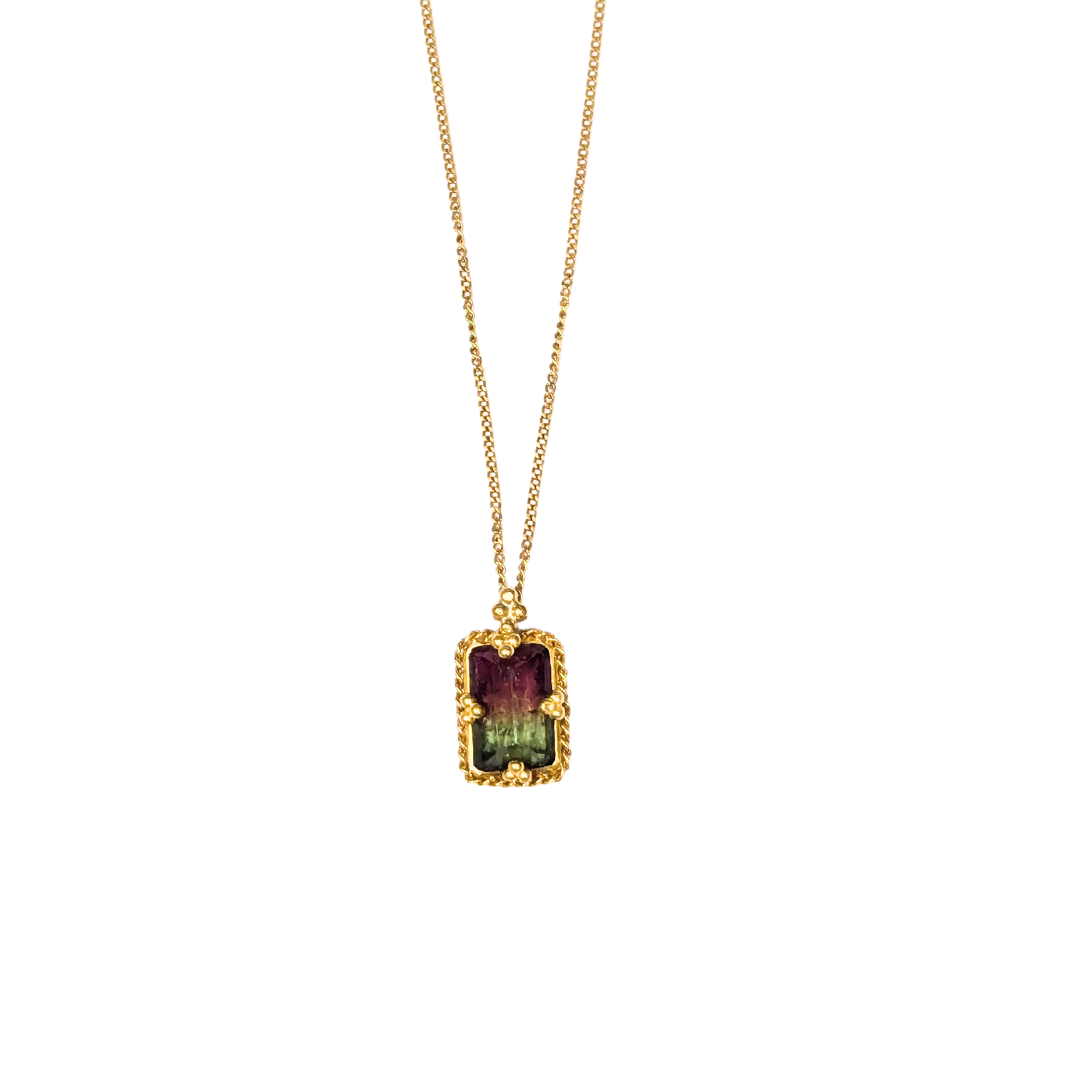 18k yellow gold necklace featuring a rectangular watermelon tourmaline pendant with pink and green hues.