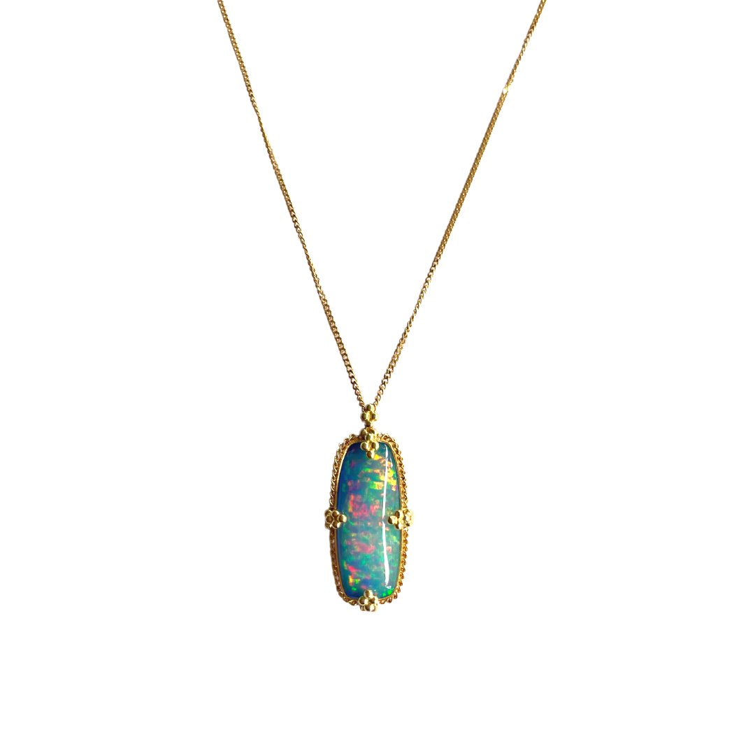 Elongated cushion Ethiopian opal necklace in 18k yellow gold with vibrant play-of-color on a delicate chain.