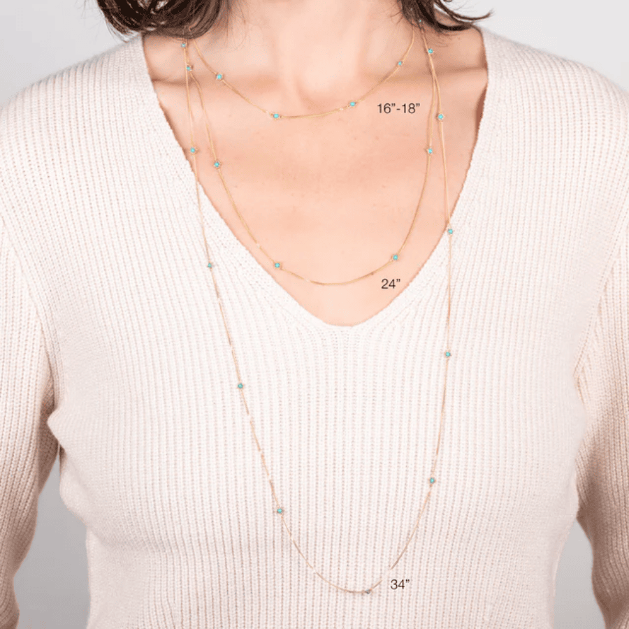 18k gold station necklace with turquoise accents, shown in 16-18, 24, and 34-inch lengths on a model.