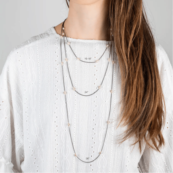 Freshwater pearl station necklace with 18k gold accents on oxidized silver chains in 16, 24, and 36-inch lengths.