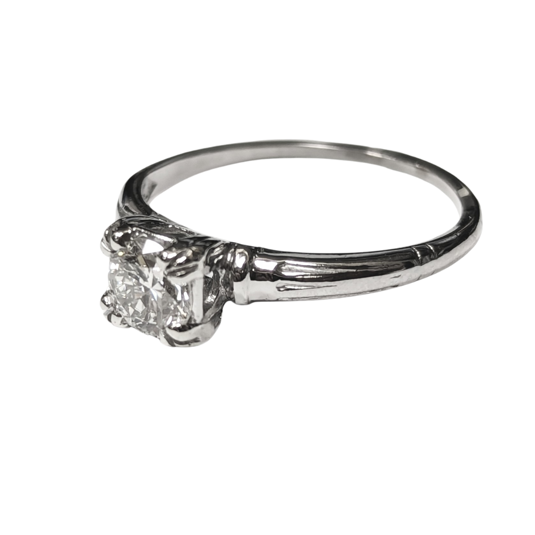 0.52 carat Old European cut diamond solitaire ring in polished platinum with a classic prong setting.