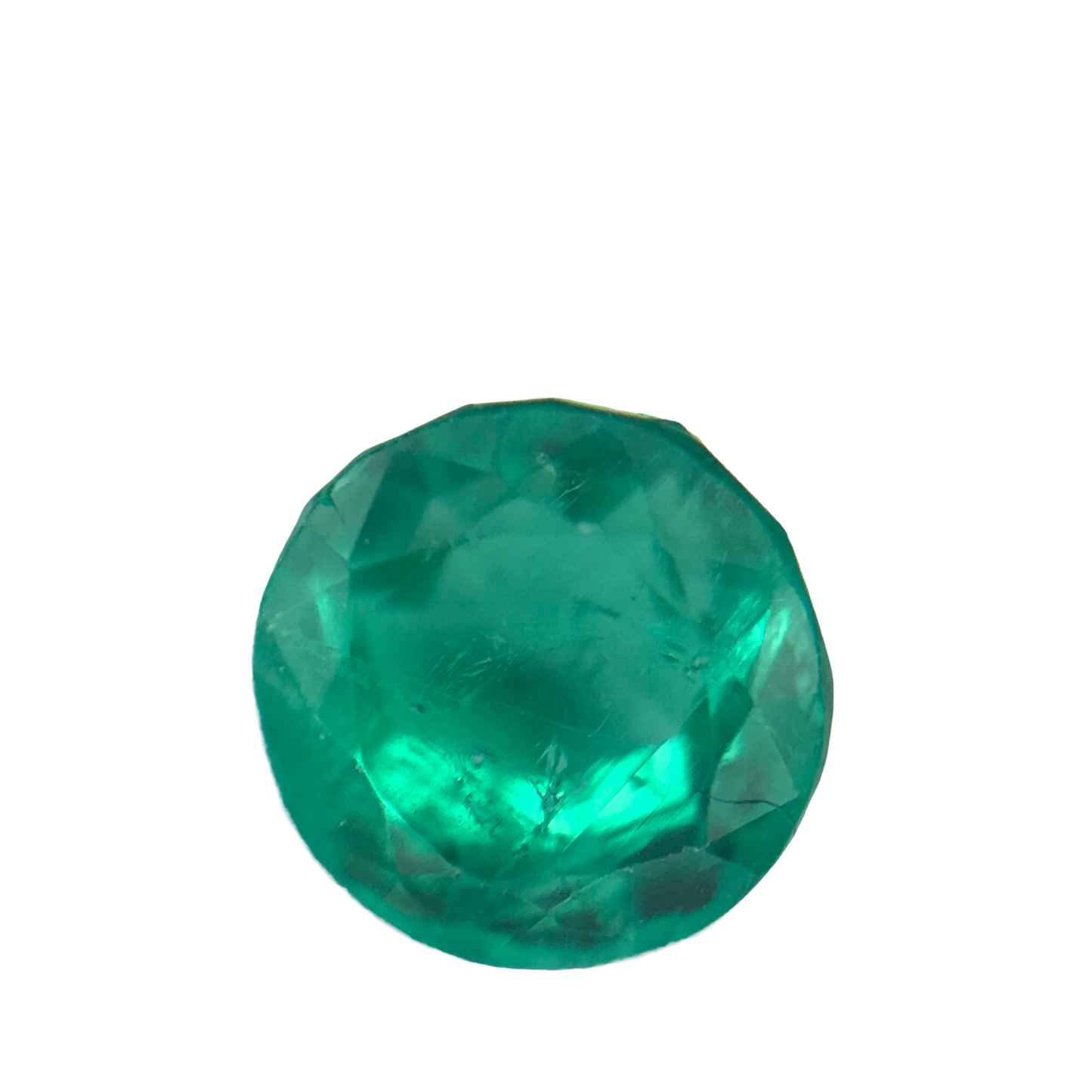 A 0.92 carat round-cut emerald gemstone with a vibrant green color and faceted surface isolated on white.