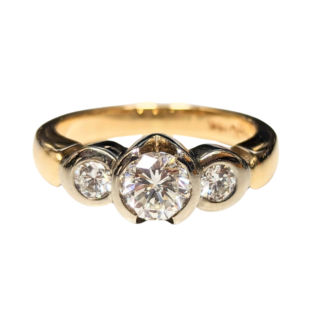 14k two-tone gold three-stone engagement ring with a 0.56ct center diamond and two side diamonds.