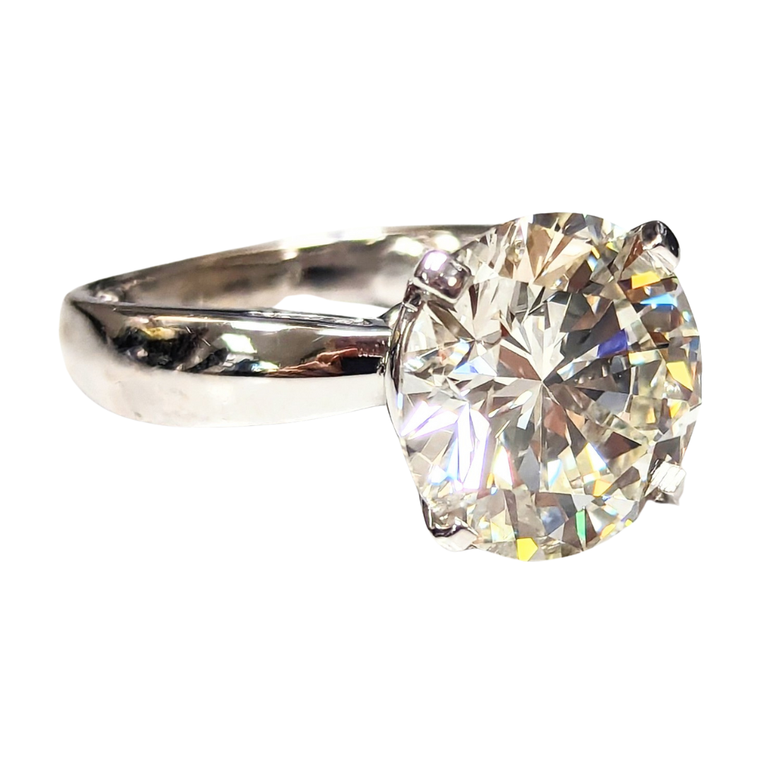 8.18 carat round brilliant cut diamond solitaire ring set in polished 14k white gold.