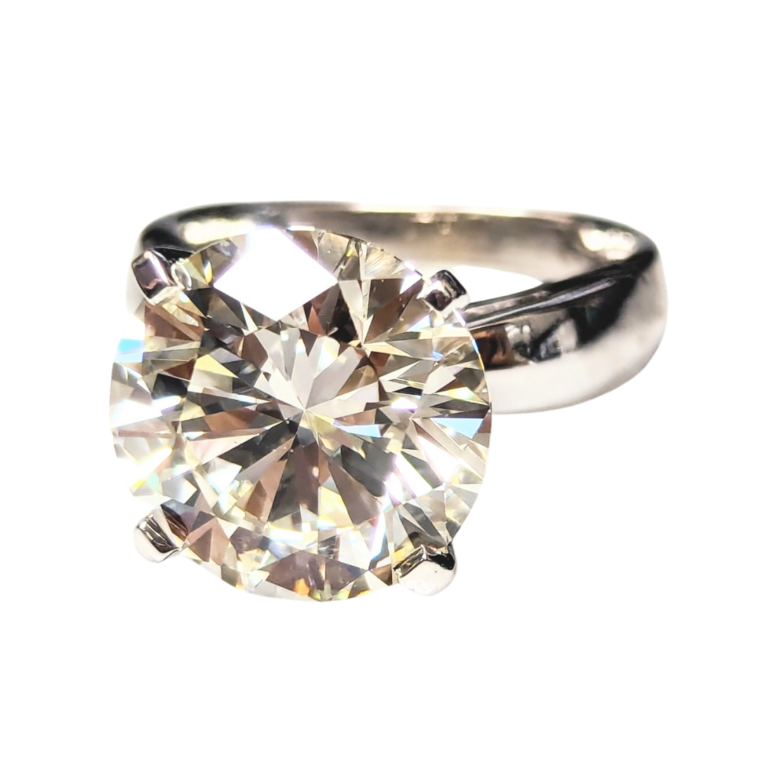 8.18 carat round brilliant cut diamond solitaire ring set in polished 14k white gold.