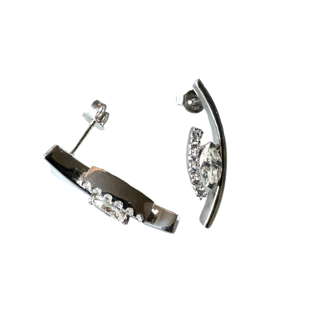 14k white gold geometric swoop earrings featuring marquise and round brilliant cut diamonds on a white background.