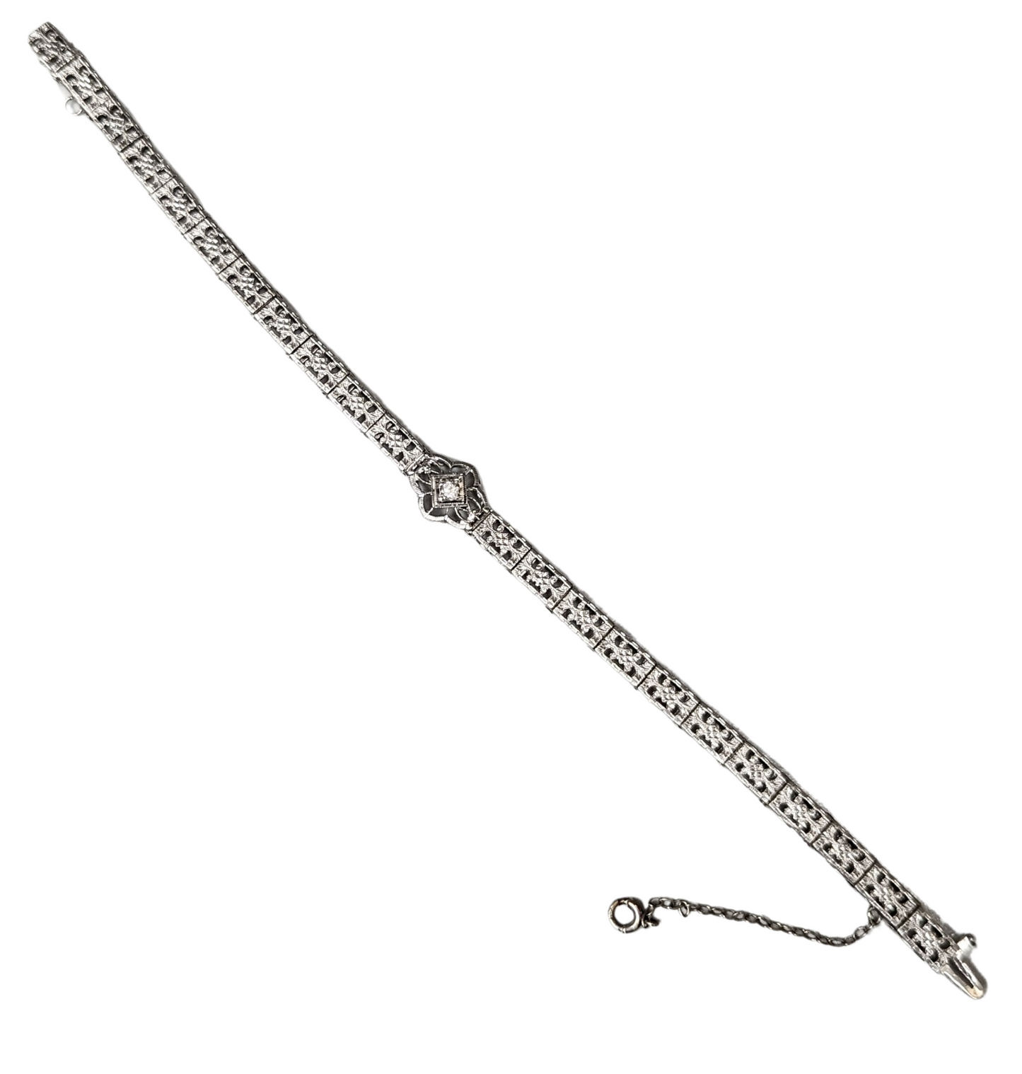 14K white gold Art Deco filigree link bracelet featuring a center Old European cut diamond accent on a white background.