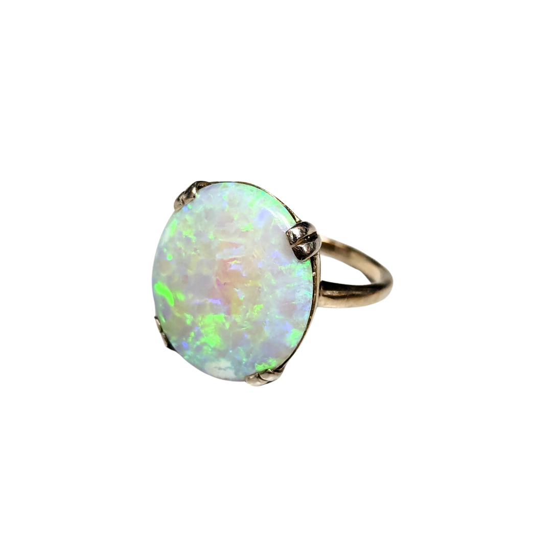 9.30ct oval opal ring in 14k white gold with a double prong setting.