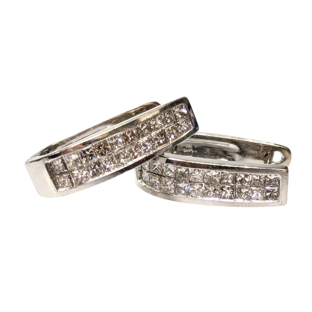 14k white gold huggie earrings featuring 0.60ct invisible-set princess cut diamonds.