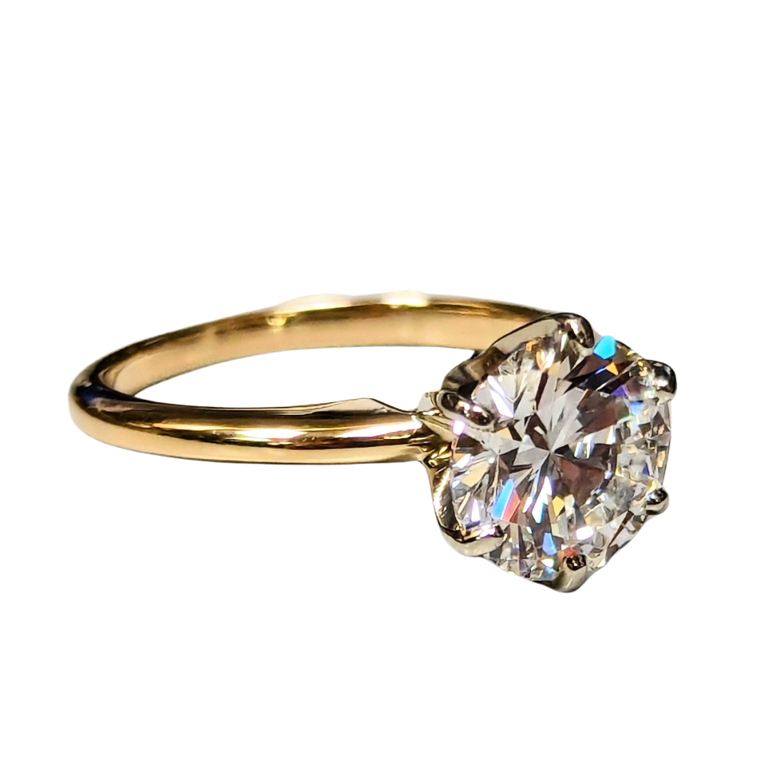 2.11 carat round brilliant diamond solitaire engagement ring set in polished 14k yellow gold.