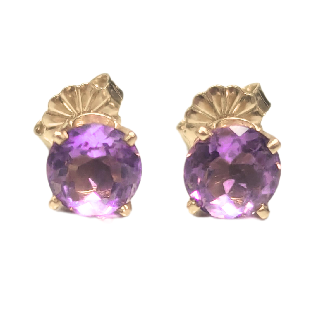6mm round amethyst stud earrings set in 14k yellow gold with secure post backs.