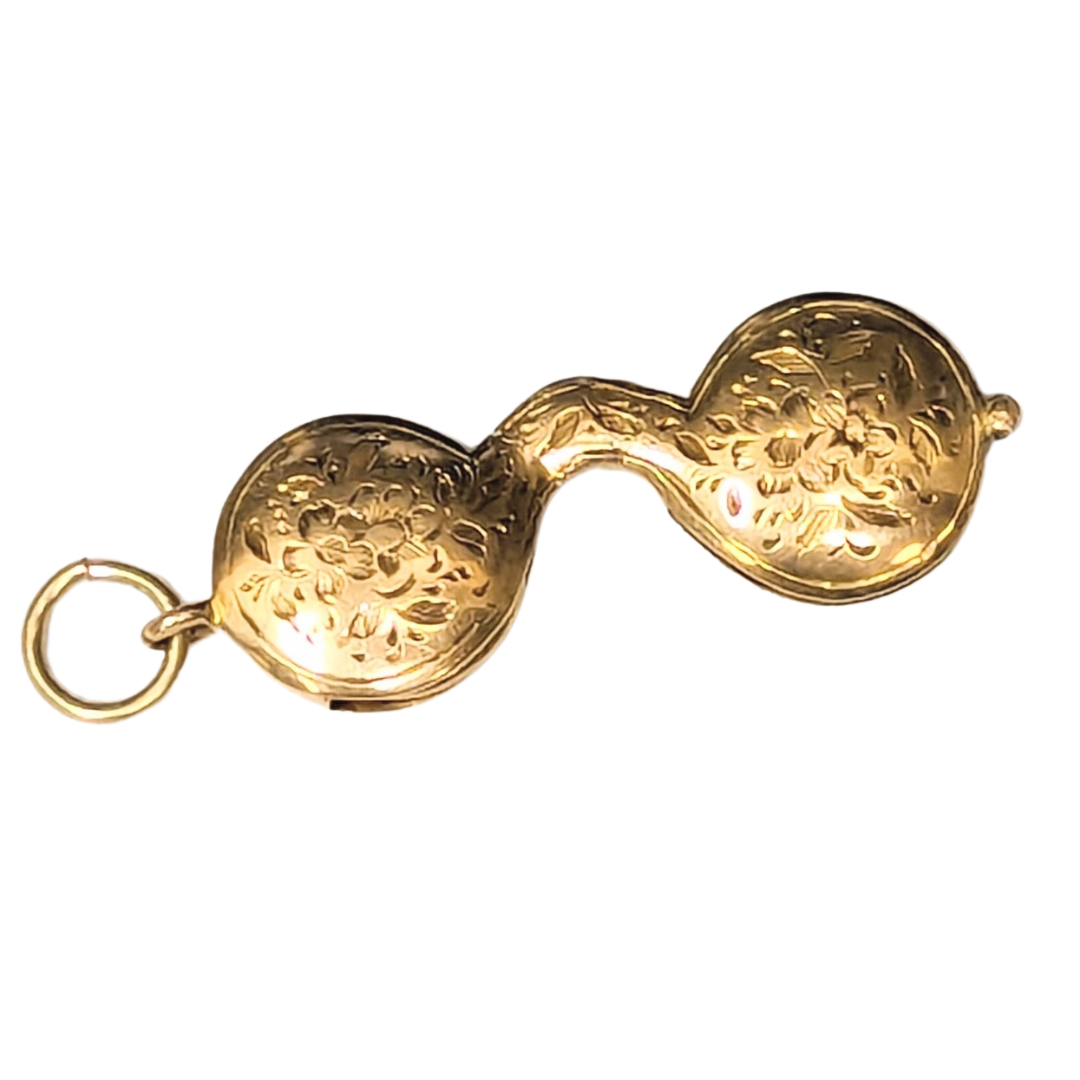 Antique 14k yellow gold lorgnette charm with intricate floral engravings and an operable folding design.