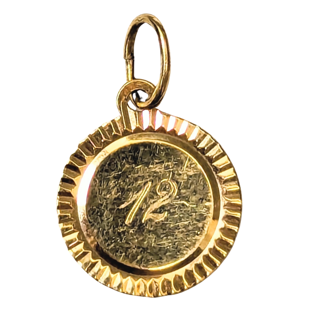 14k yellow gold fluted disc pendant charm featuring the number 12 engraved on a textured circular face.