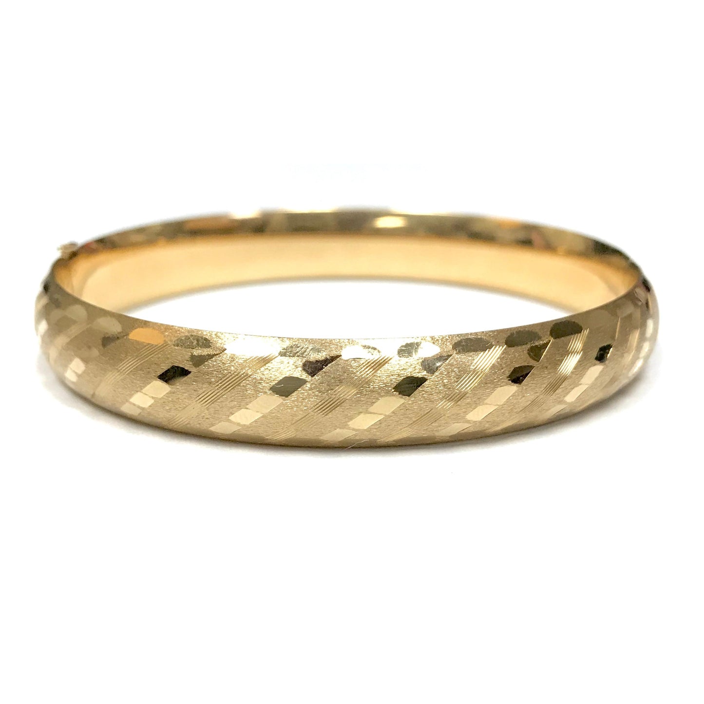 14k yellow gold hinged hollow bangle featuring a 10.40mm wide band with intricate laser-etched textured detailing.
