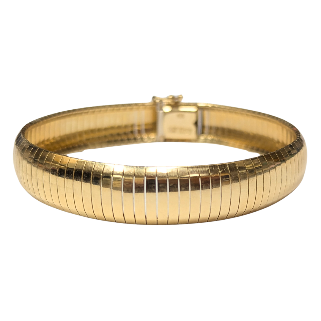 14k yellow gold 11.75mm wide omega bracelet, 8 inches long with a secure box clasp and safety closure.