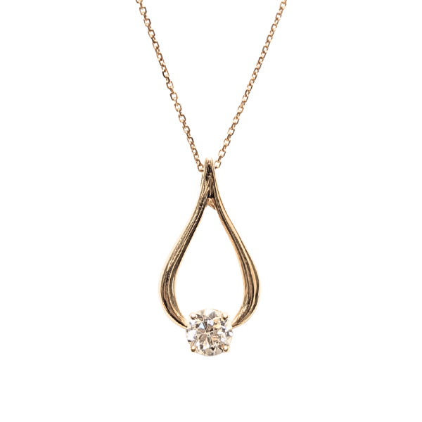 14k yellow gold pear-shaped pendant featuring a 0.56 carat old European cut diamond.