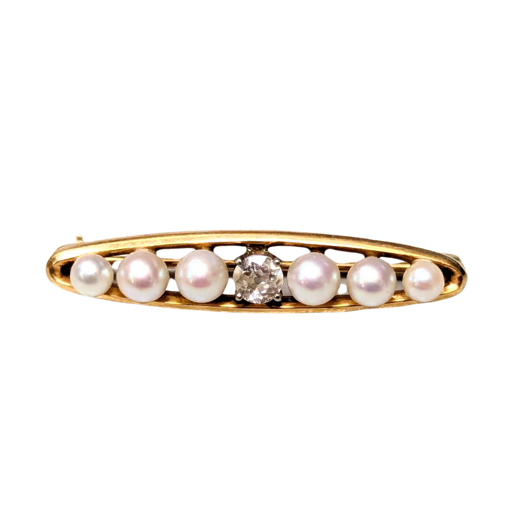 14k yellow gold bar pin featuring six cultured pearls and a central .13ct Old European cut diamond.