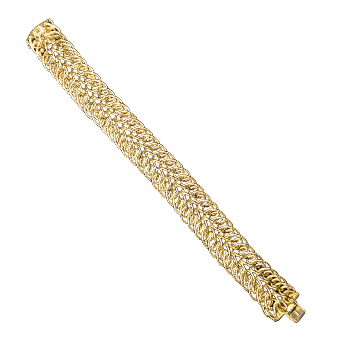 14k yellow gold 18mm wide Sedusa link bracelet with polished, etched texture and a secure box clasp.
