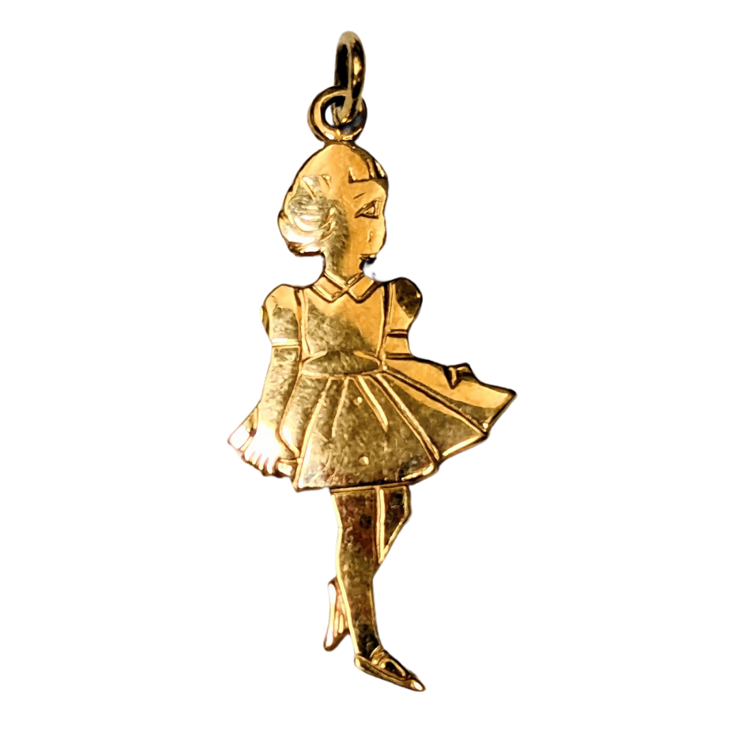 14k yellow gold charm featuring a detailed silhouette of a young girl in a dress, designed as a jewelry pendant.