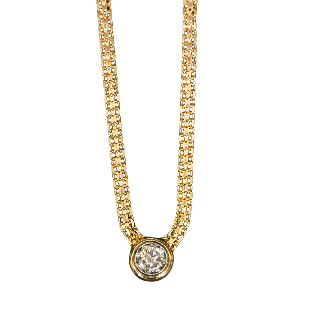 2.31 carat round diamond in a 14k yellow gold bezel setting on a woven X-link chain.