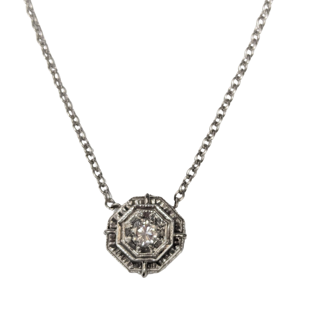 18k white gold Art Deco necklace featuring a 0.25 carat round diamond in a geometric solitaire setting.