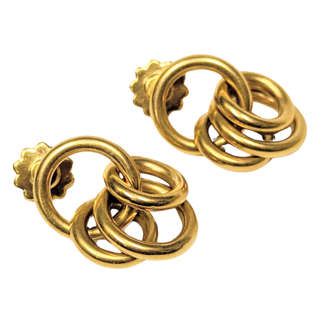 Chimento multi-hoop earrings crafted in polished 18k yellow gold with a linked circular design and post-back closures.