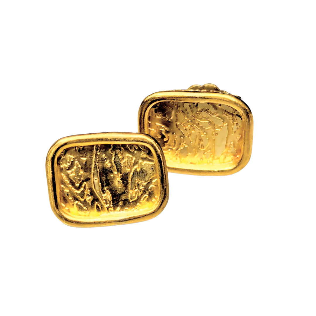 Rectangular 18k yellow gold stud earrings featuring a textured, organic patterned surface.