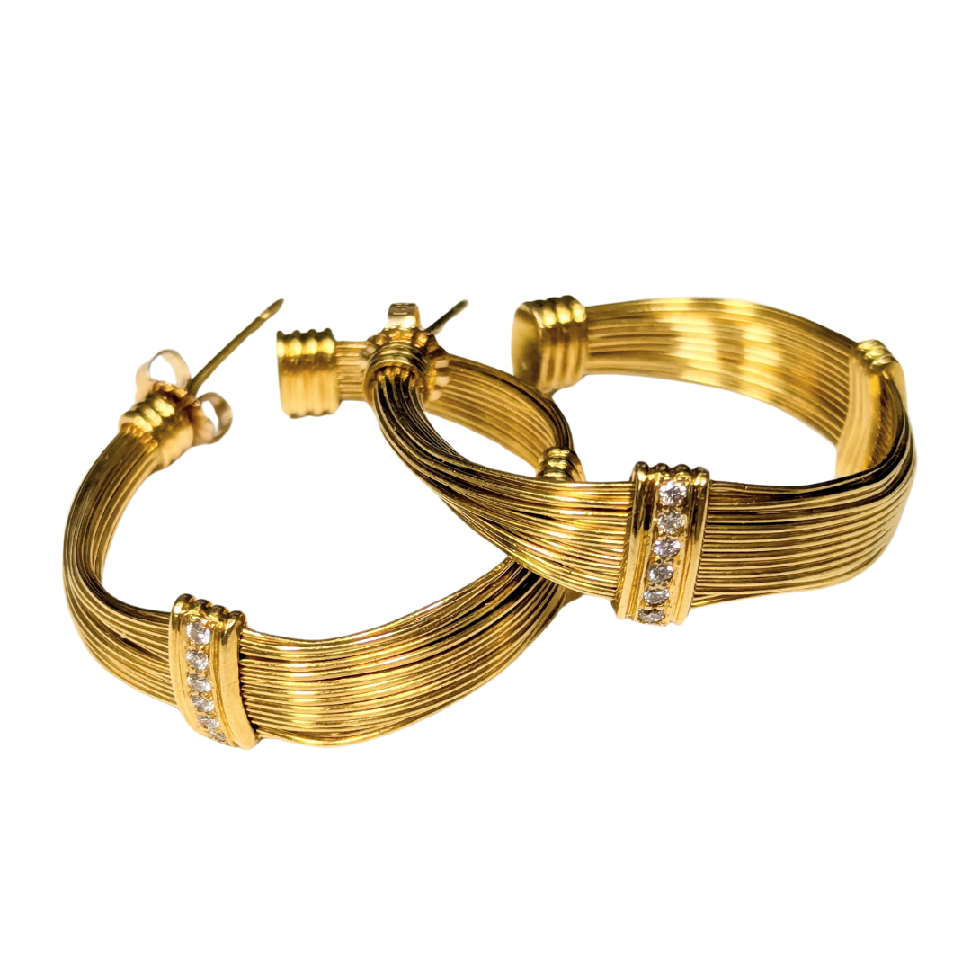 18k yellow gold wire hoop earrings featuring a multi-strand design with sparkling diamond accents.