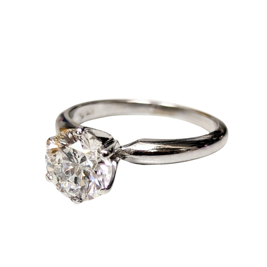 1.28ct round brilliant diamond solitaire engagement ring in 14K white gold with a classic six-prong setting.