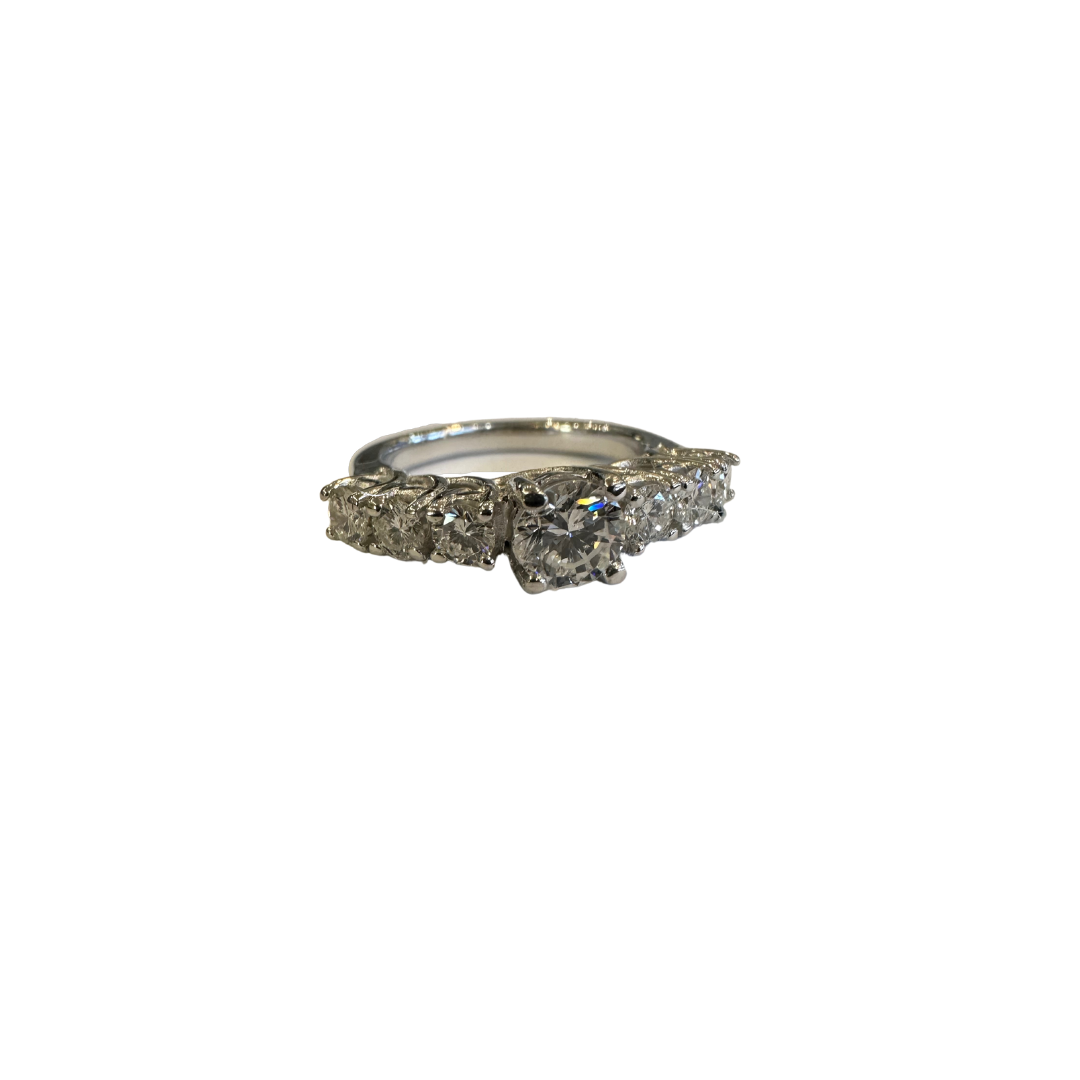 18k white gold 7-stone diamond ring featuring a round center diamond and six side stones on a size 4.75 band.