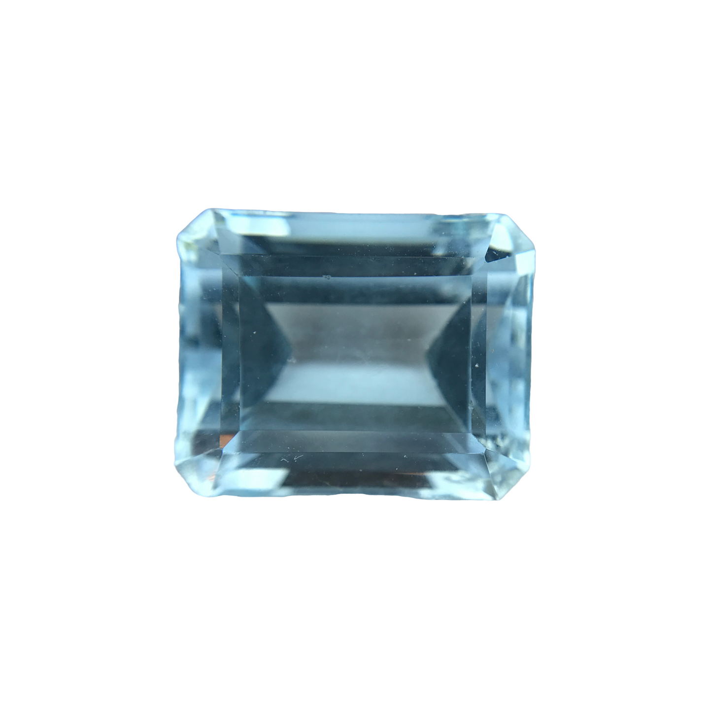 8.09 carat emerald cut aquamarine gemstone with a clear, light blue color and rectangular faceted design.