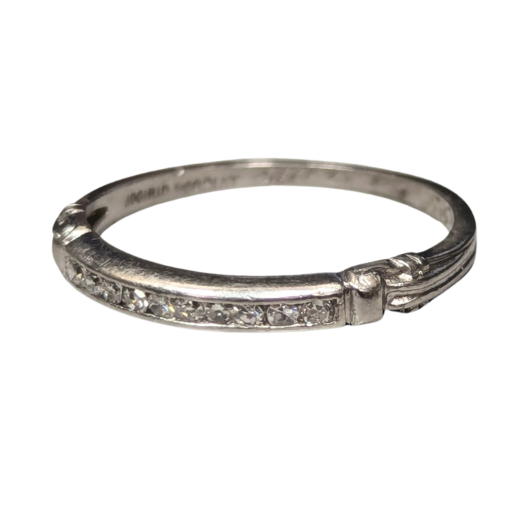 Antique platinum size 6 ring featuring a channel of ten single-cut diamonds totaling 0.10 carats on a silver-toned band.