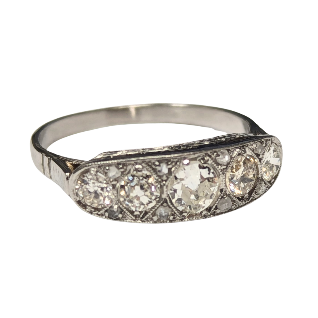 Art Deco platinum filigree ring featuring five old European cut diamonds and delicate rose cut diamond accents.