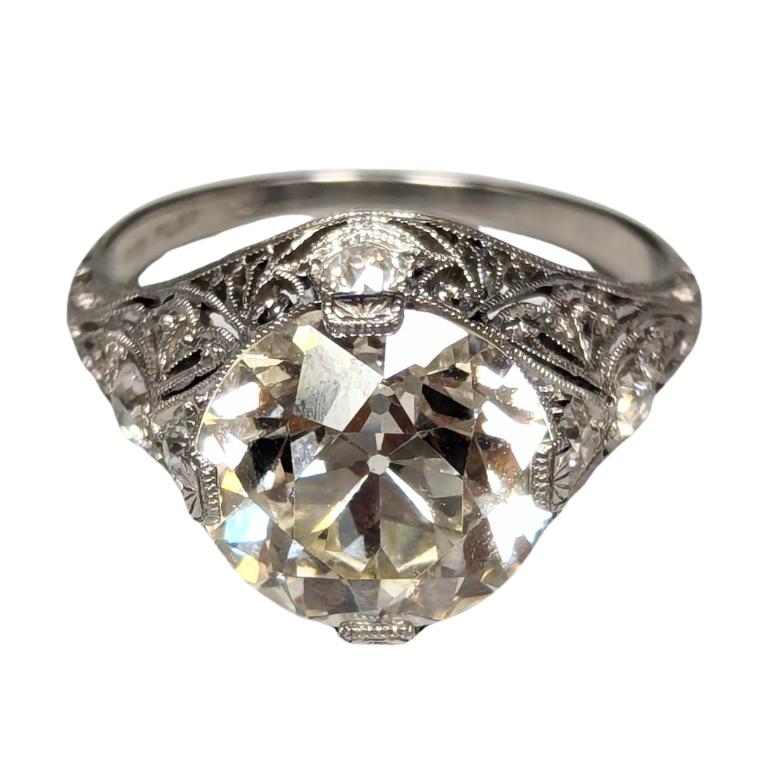 Art Deco platinum filigree ring featuring a 5.01-carat Old European cut diamond center stone.