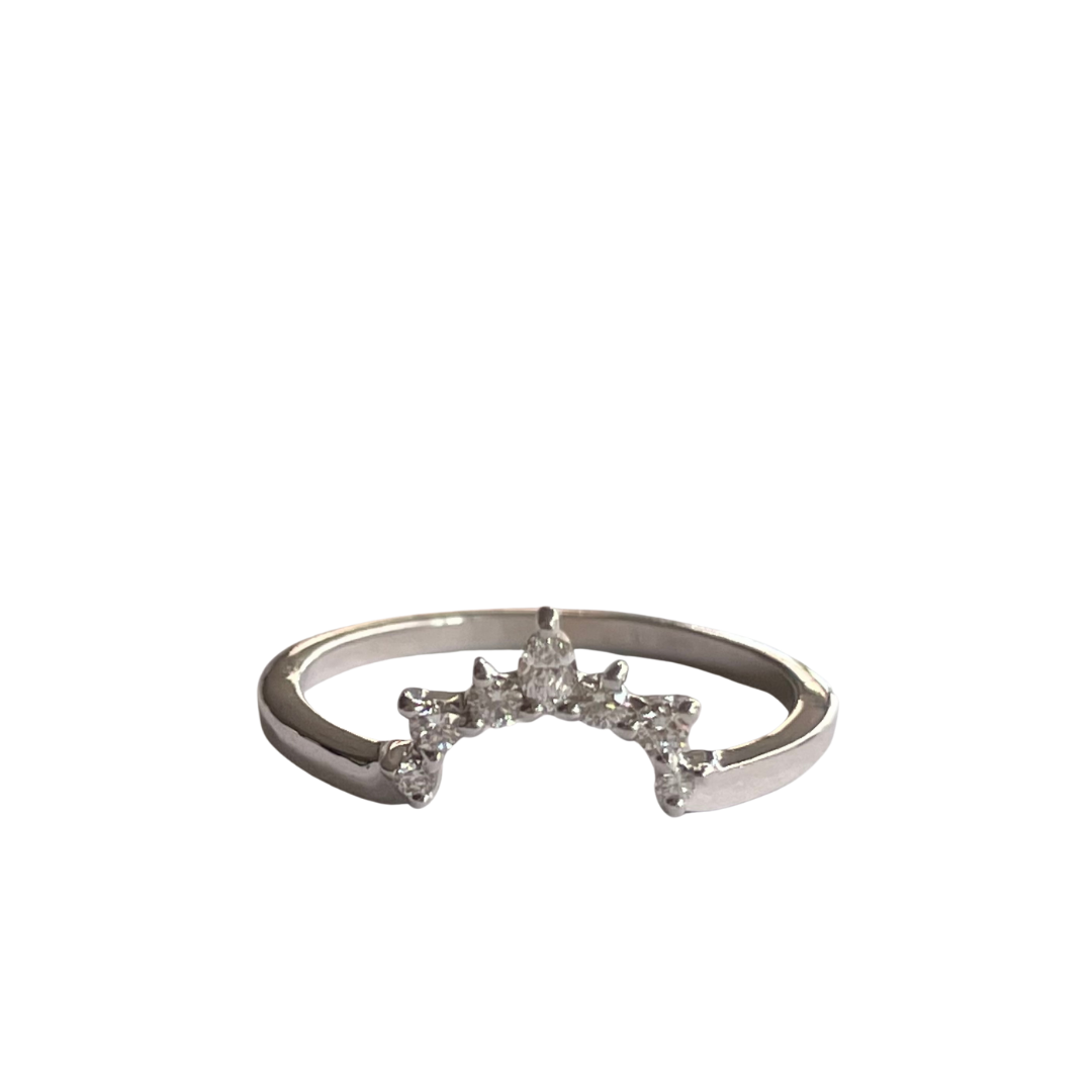 Curved 14K white gold wedding band featuring six round diamonds and one marquise diamond.