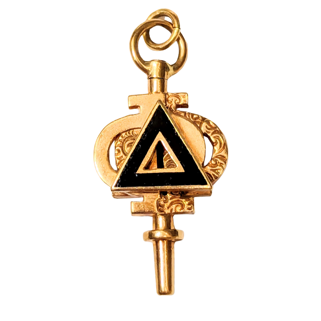 Gold-plated Phi Delta Phi key charm featuring an ornate design and a central black enamel triangle inlay.