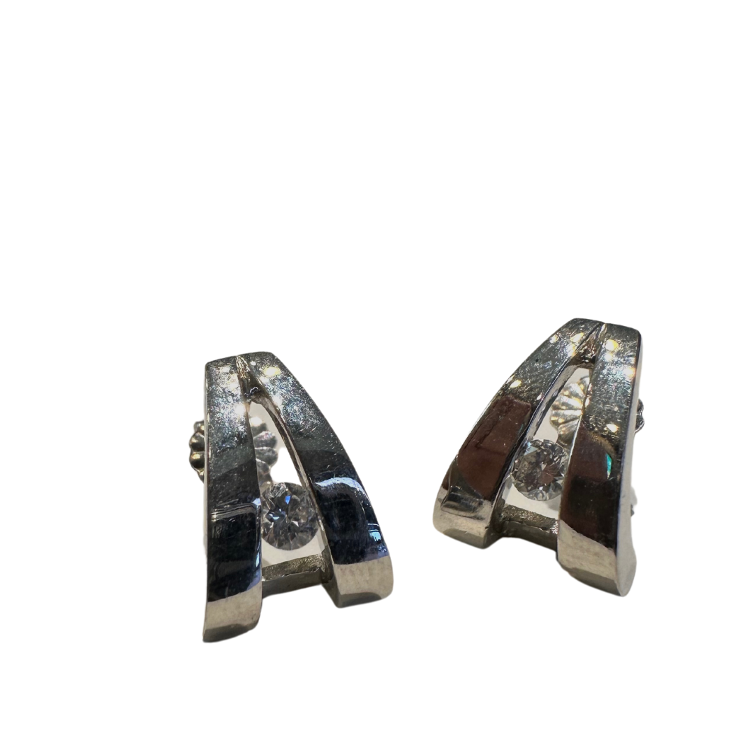 John Atencio platinum earrings featuring round brilliant cut diamonds in a modern, architectural open-frame design.