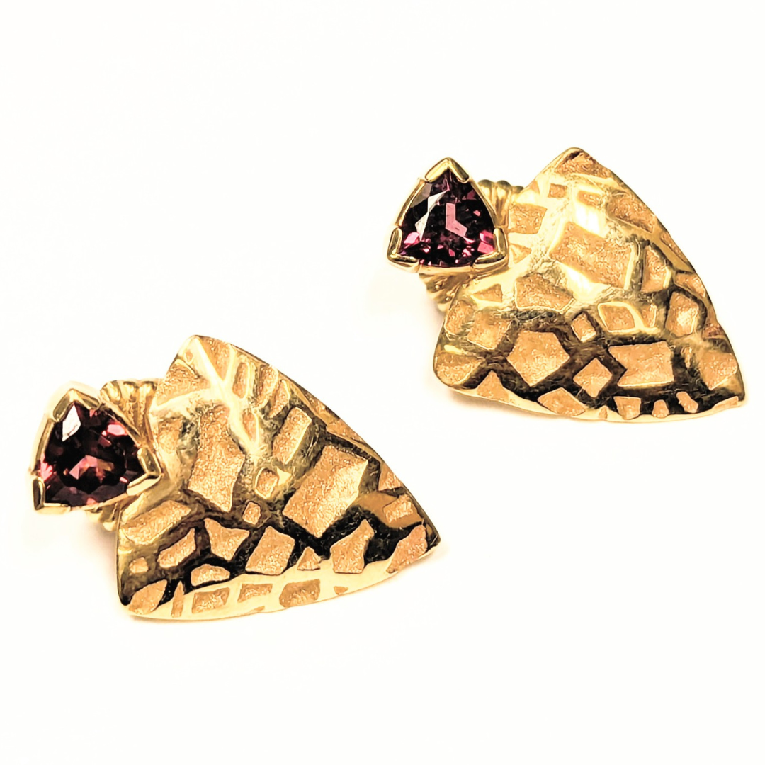14k yellow gold modernist shield earrings with textured geometric patterns and trillion-cut pink tourmalines.