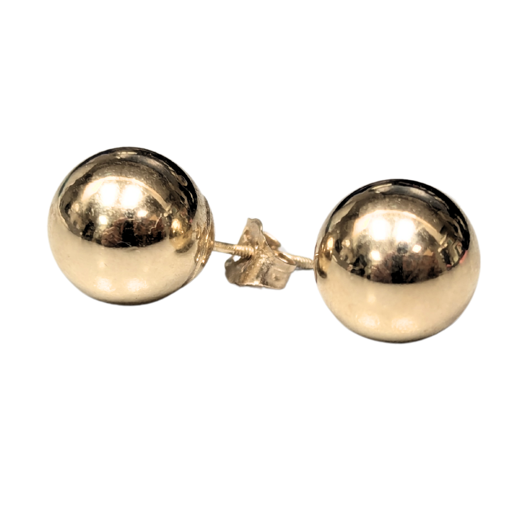 Pair of 9.9mm polished 14k yellow gold hollow ball stud earrings with secure post backs.