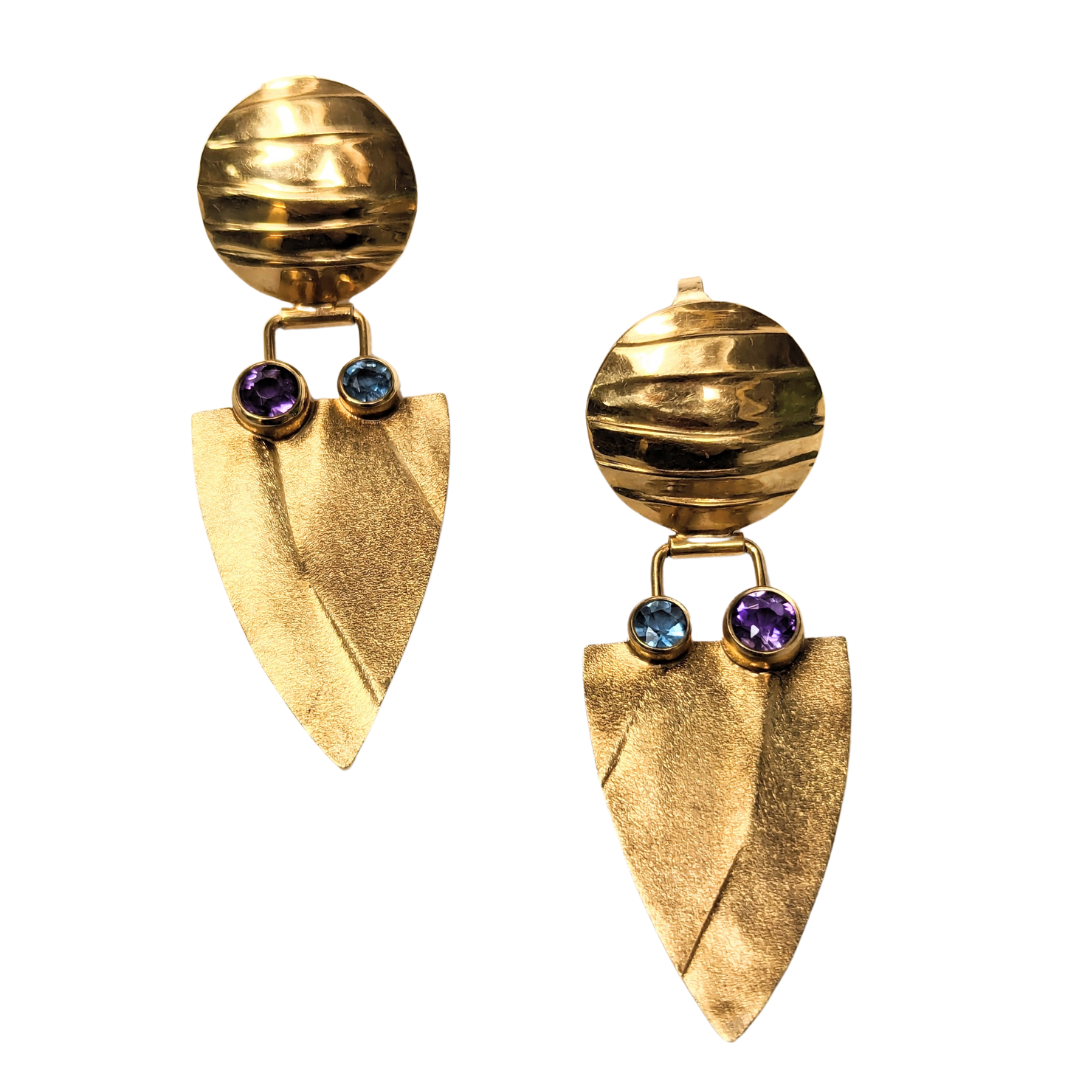 14k yellow gold modernist drop earrings with shield-shaped leaf pendants, blue topaz, and amethyst accents.