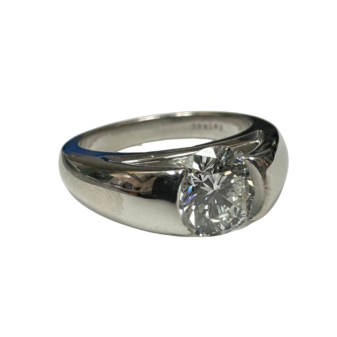 Paul Klecka platinum engagement ring featuring a 1.24 carat round brilliant cut diamond in a sleek tension-style setting.