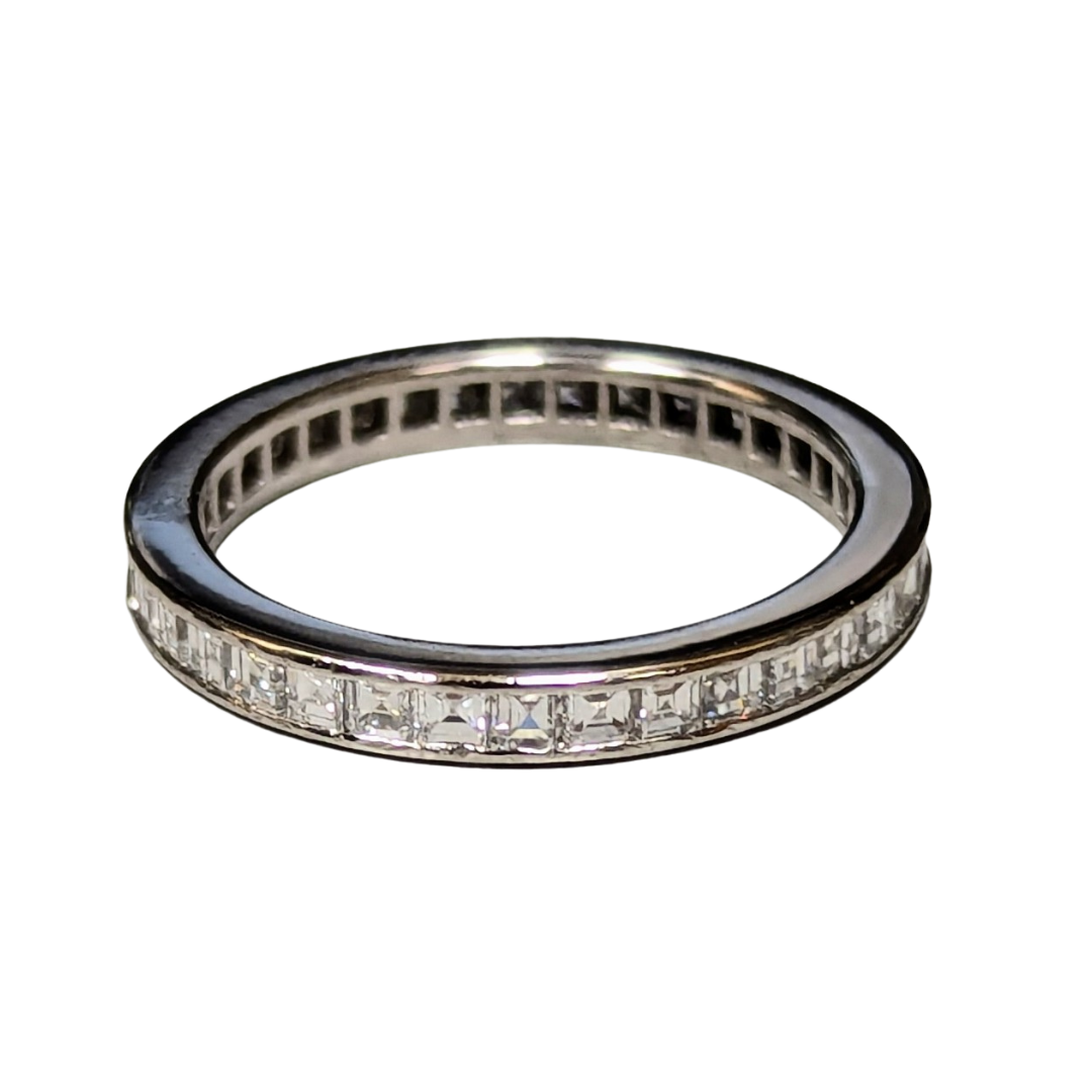 Platinum eternity band featuring 35 channel-set square step-cut diamonds totaling 0.70 carats.