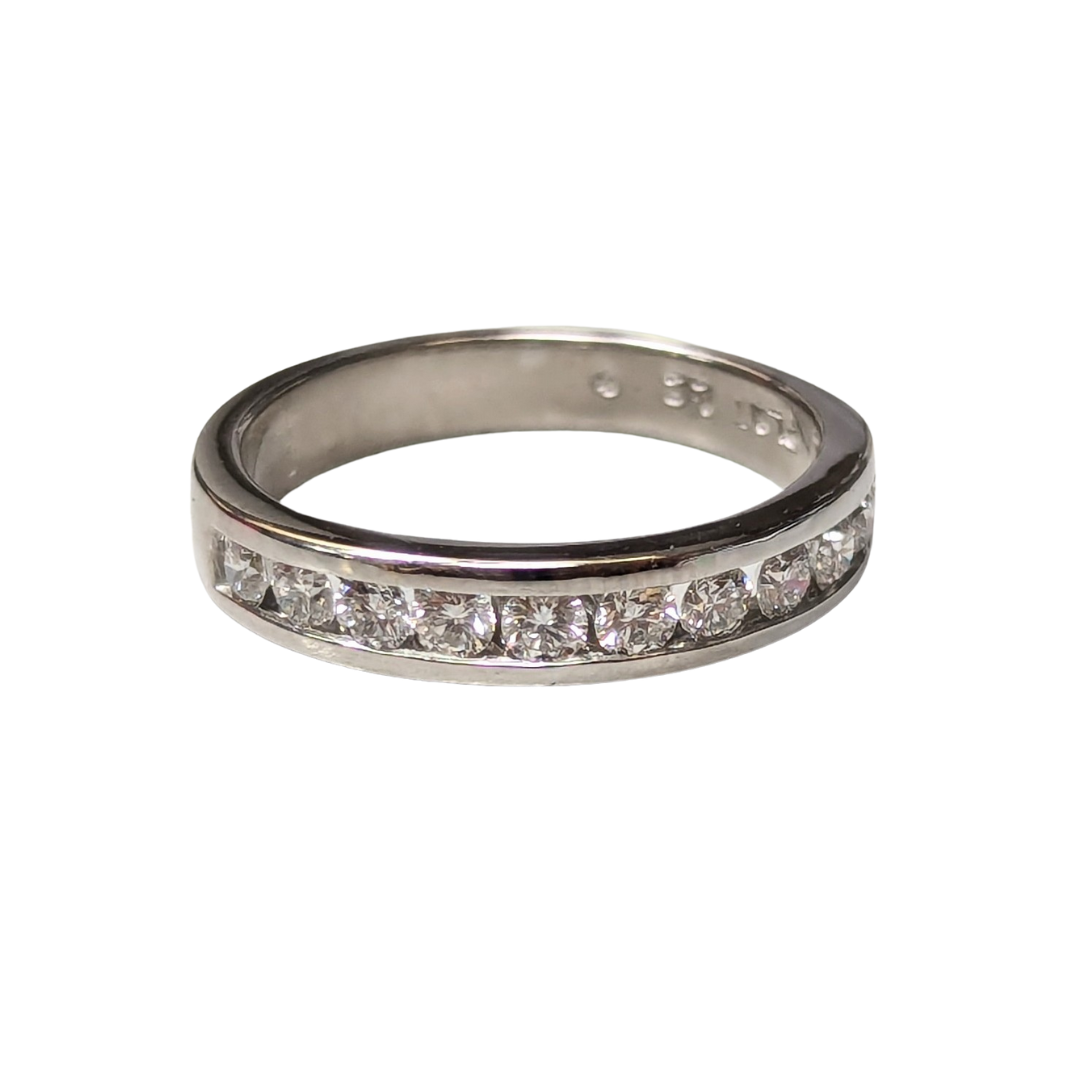 Platinum half-eternity band featuring 11 channel-set round brilliant diamonds in a polished silver-tone metal finish.