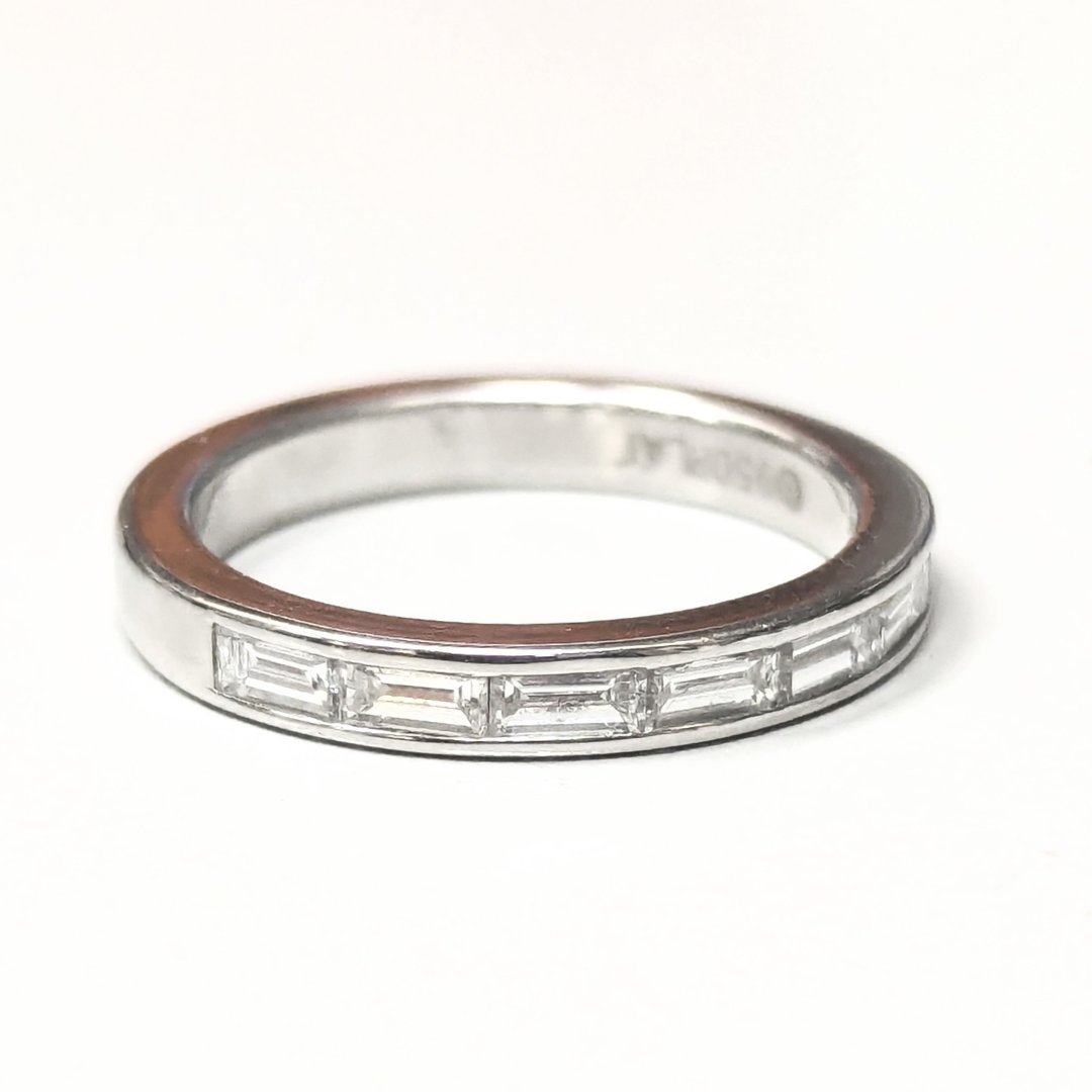Platinum half-eternity wedding band featuring seven channel-set baguette diamonds on a polished silver-tone band.