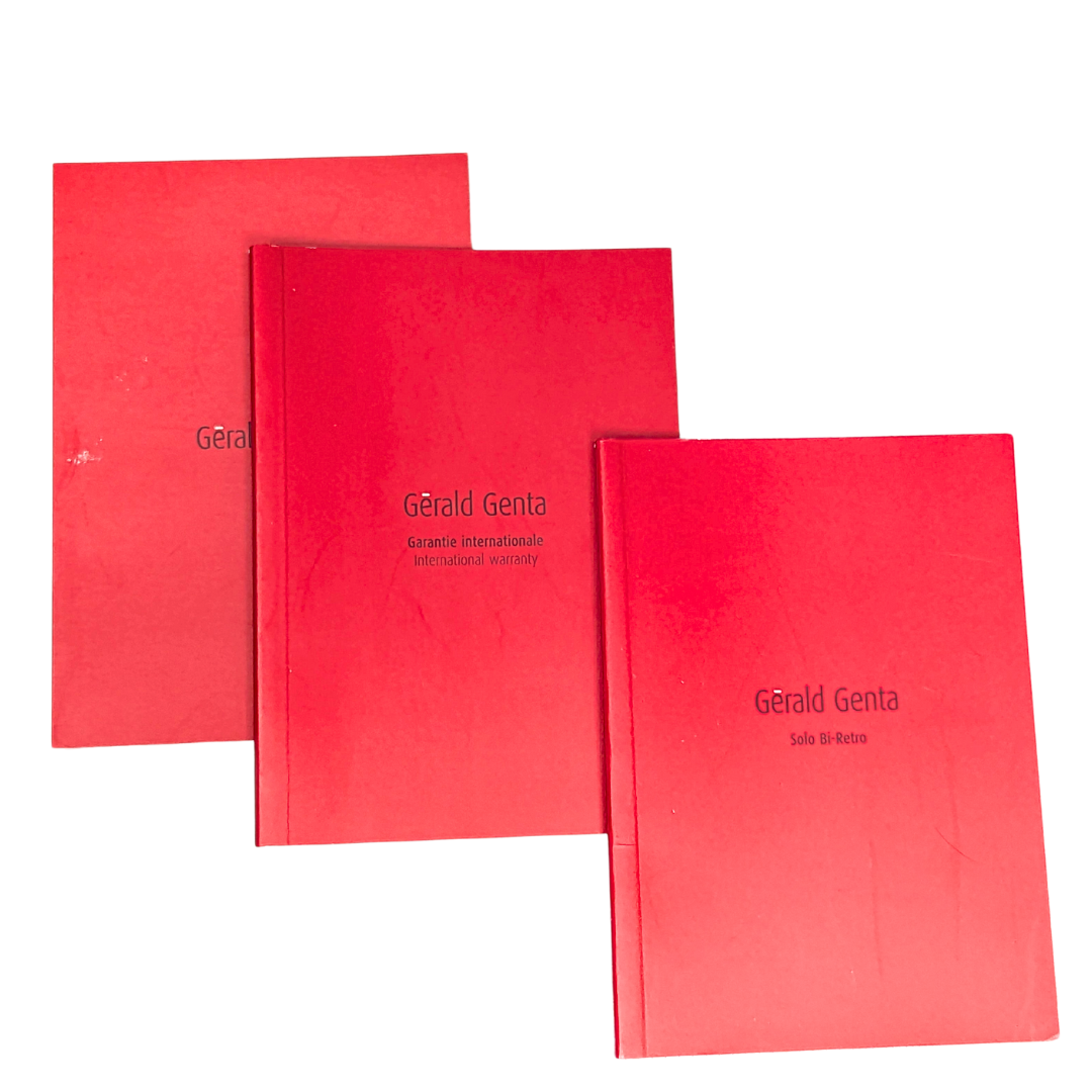 Three bright red Gerald Genta watch booklets, including an international warranty and Solo Bi-Retro manual.