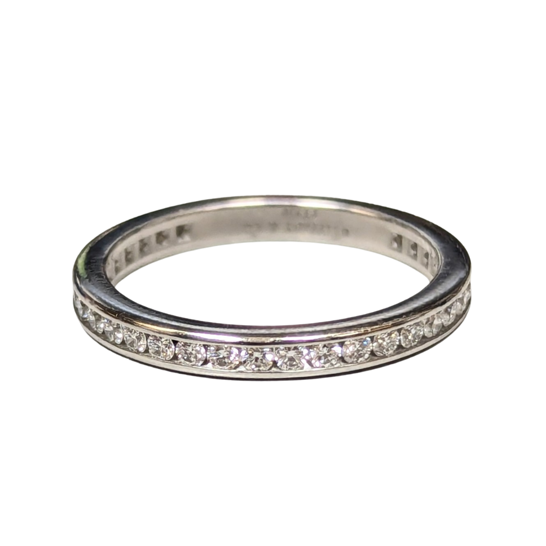 Tiffany & Co. platinum wedding band featuring 38 channel-set diamonds in a size 5 ring.