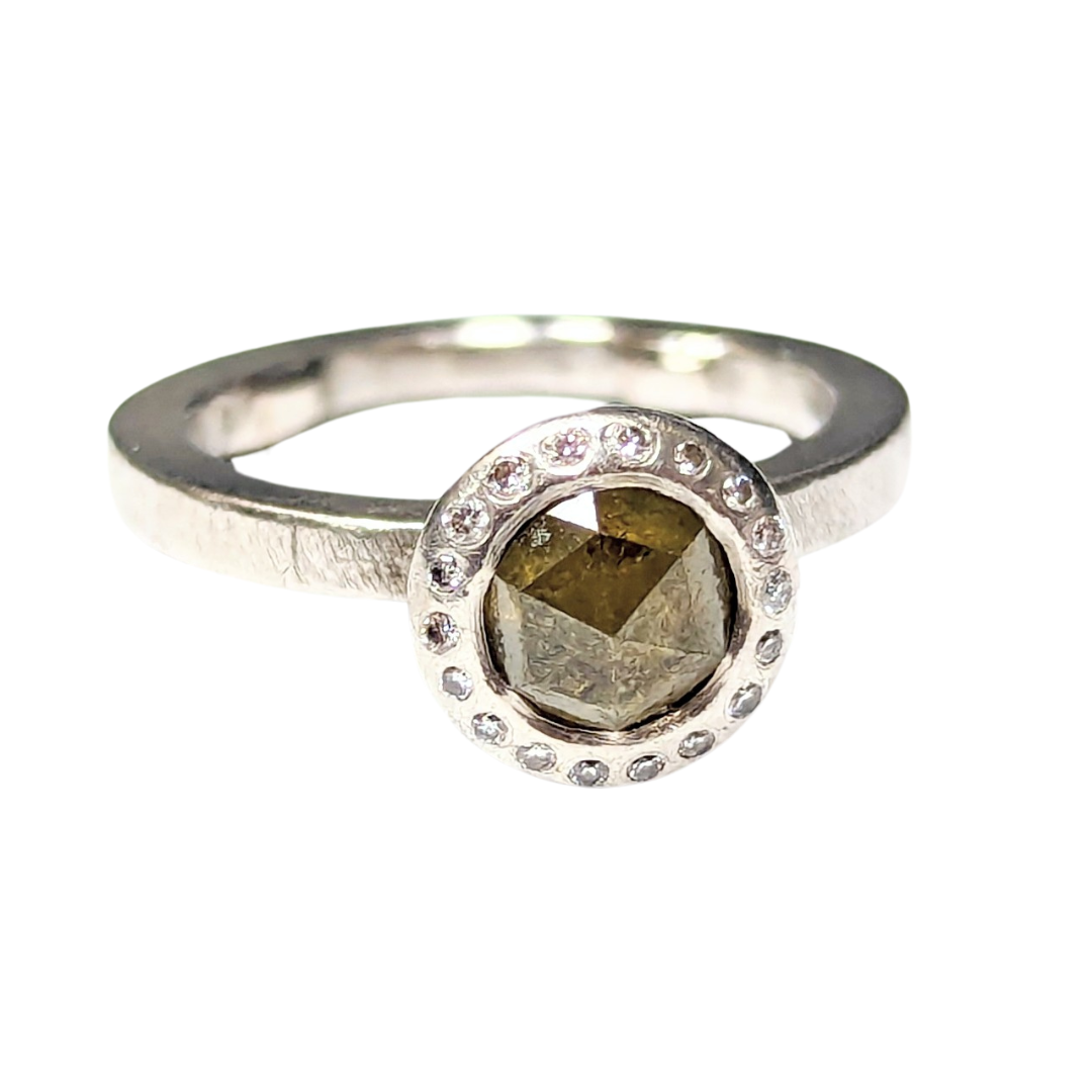 Todd Reed palladium ring featuring a rose-cut yellowish-green diamond haloed by 18 small round brilliant diamonds.