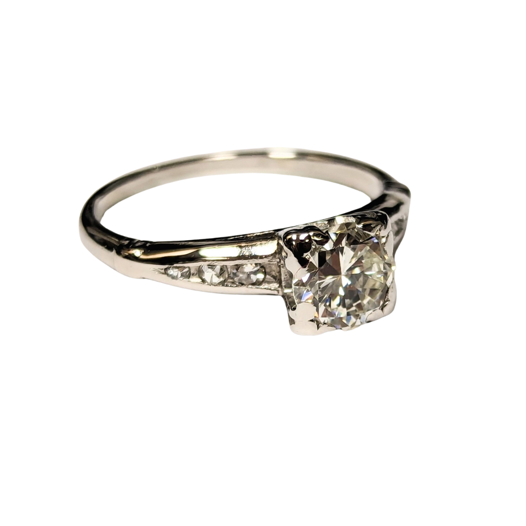Platinum transitional cut diamond ring with a 0.73ct center stone and accent diamonds on a polished band.
