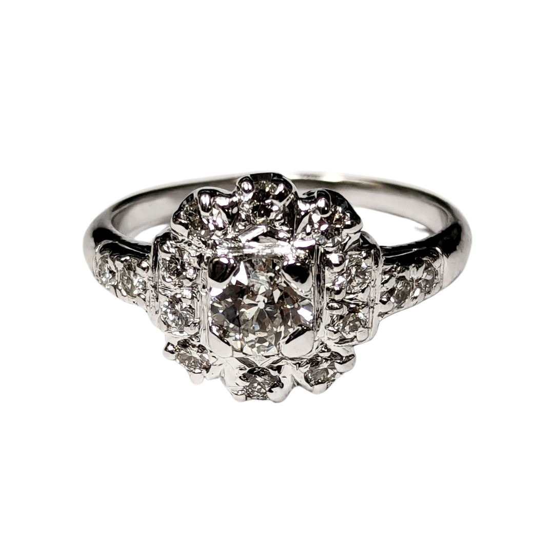 Vintage 14k white gold cluster ring featuring a central Old European cut diamond surrounded by round brilliant diamonds.