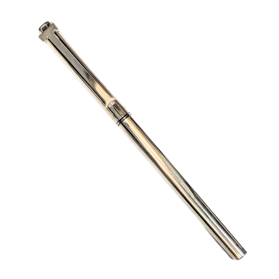 Vintage Tiffany & Co. sterling silver ballpoint pen featuring a polished metallic finish and a signature T-clip design.